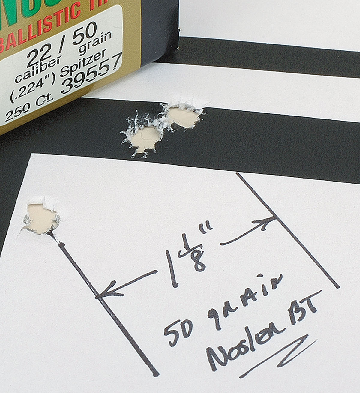Every bullet weight has its day and with the 50-grain Nosler, Stan came up with this group of 11⁄8 inches with two shots touching. Midrange bullet weights showed the Hornady 52-grain A-MAX produced one-inch groups over 30.0 grains of IMR-4320. Slightly heavier bullet weights include one of Stan’s all-time favorites, Remington’s 55-grain hollowpoint, that punched this group of under an inch.